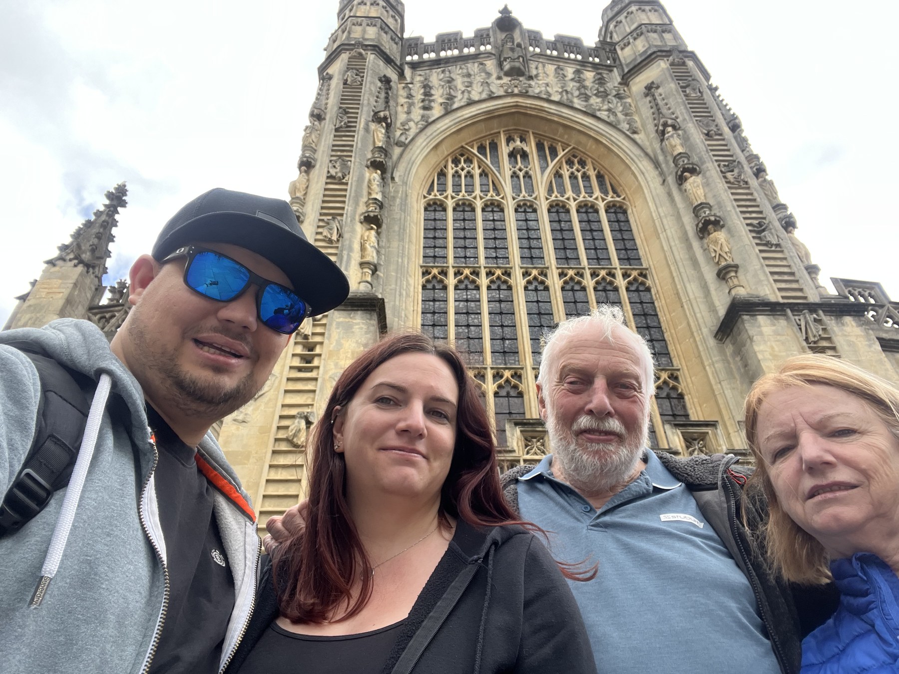Family selfie outside a large historic building