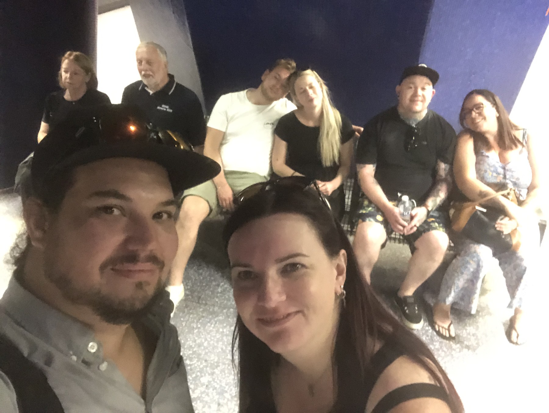 Family sitting together on steps during a trip