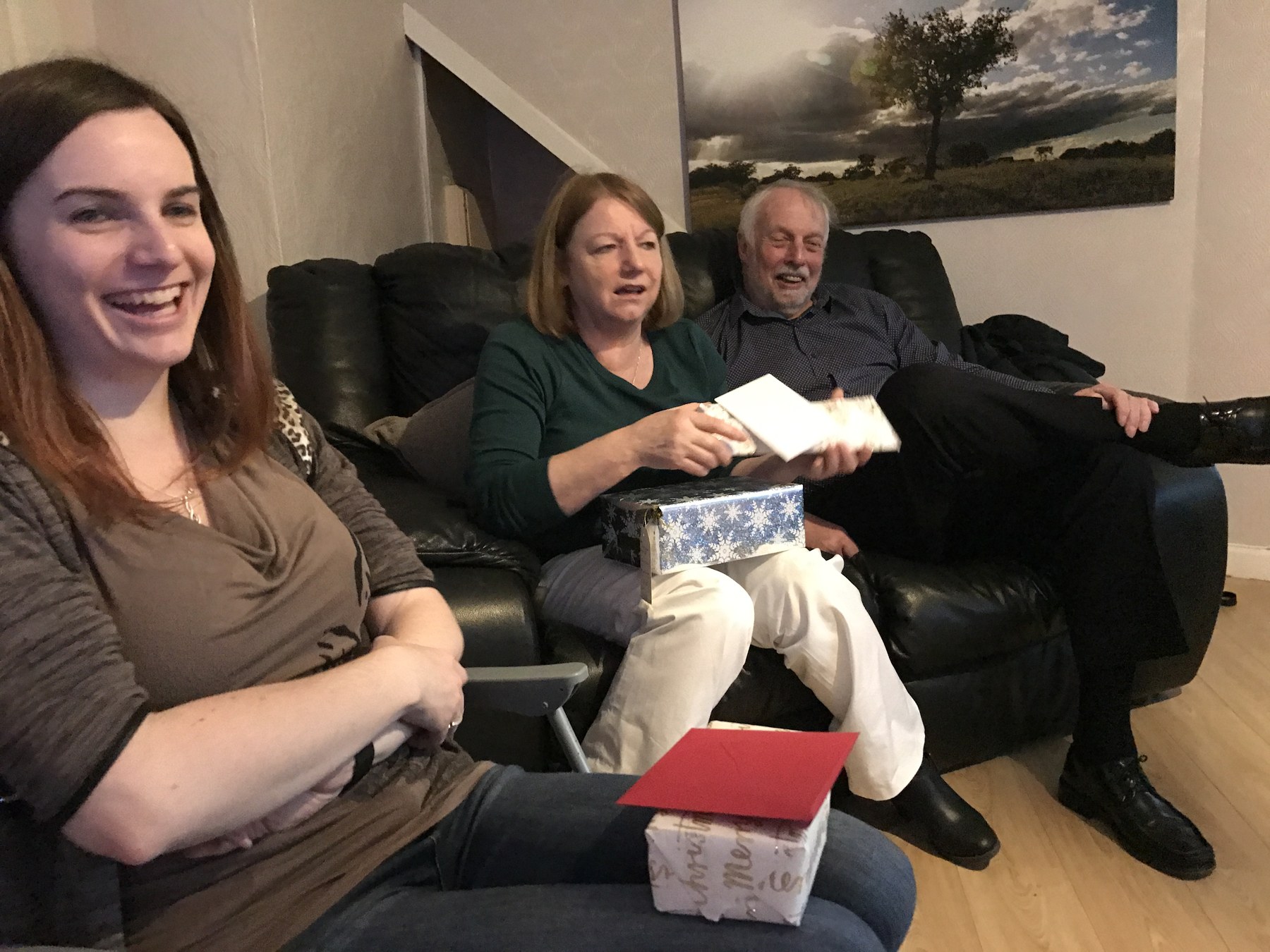 Family sitting together on a sofa
